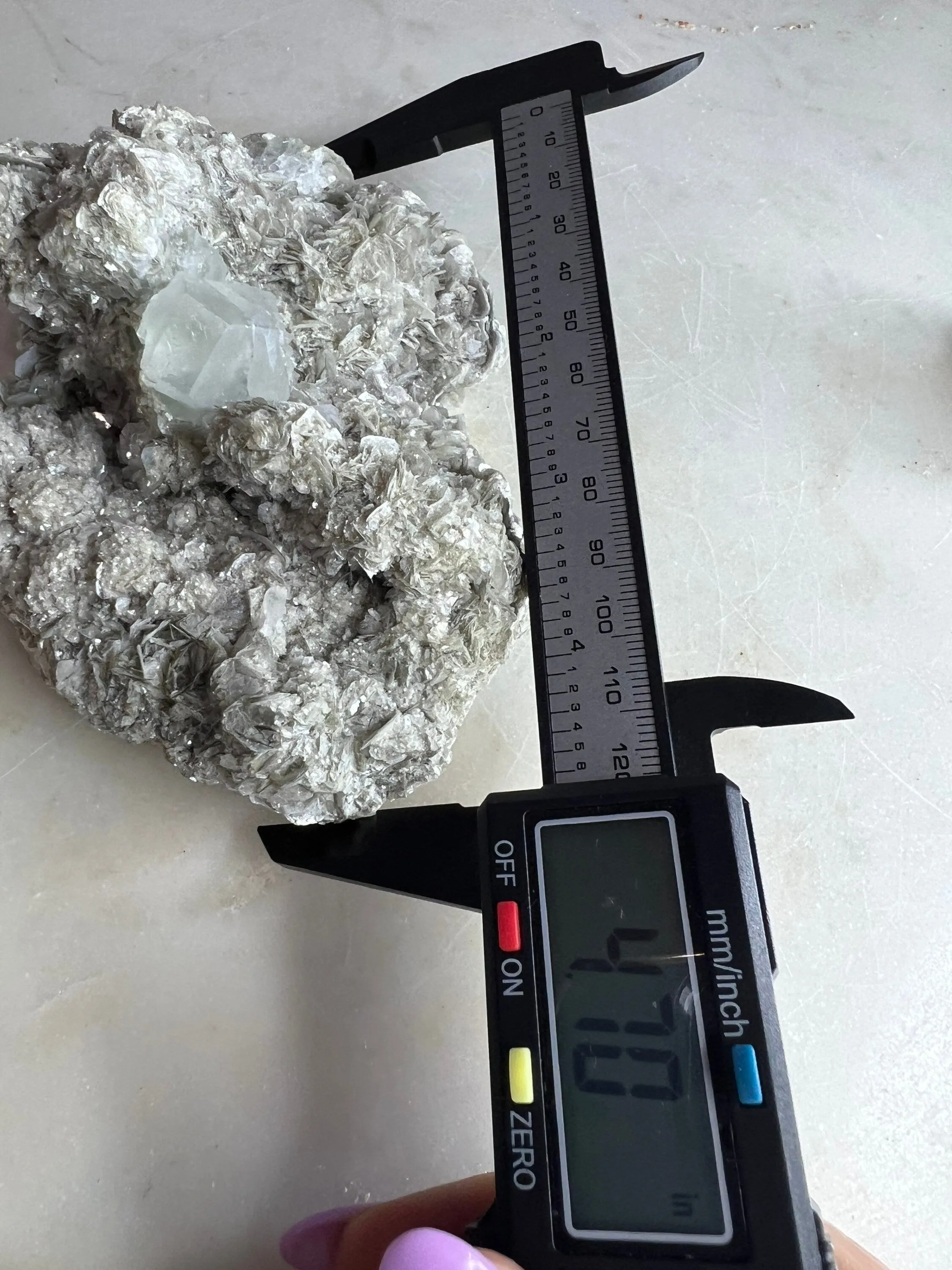 Aquamarine on mica mineral cluster is the small one and the uv reactive calcite you get both clusters. 36grams small and 428grams larger one